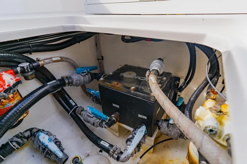  Yacht Photos Pics Engine compartment of 2024 Orion 29CC boat with visible hoses and components.