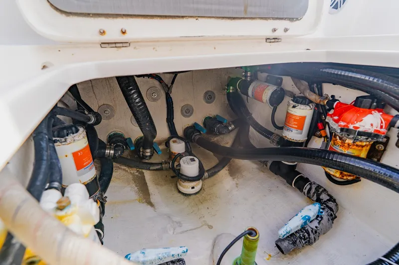  Yacht Photos Pics 2024 Orion 29CC boat engine compartment with hoses and filters.
