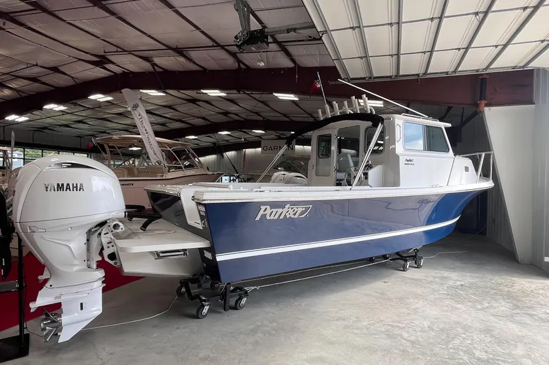  Yacht Photos Pics 2026 Parker 2520 XLD Sport Cabin boat with Yamaha engine in showroom.