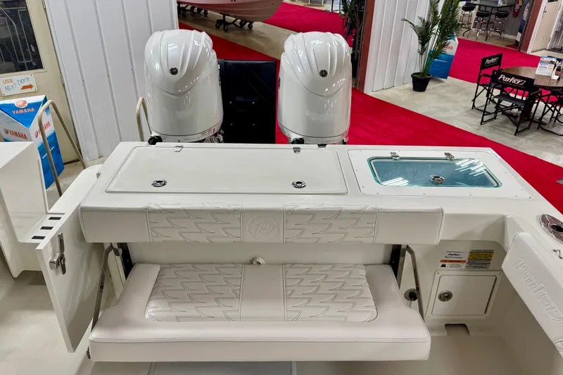  Yacht Photos Pics 2026 Parker 2520 XLD Sport Cabin boat interior with dual engines and seating.