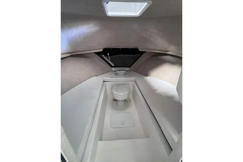  Yacht Photos Pics Interior of 2026 Parker 2520 XLD Sport Cabin, featuring a compact marine toilet.