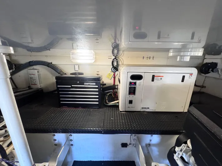 A Whole New World Yacht Photos Pics Engine room of 2006 Silverton 50 Convertible with Kohler power system and Craftsman toolbox.