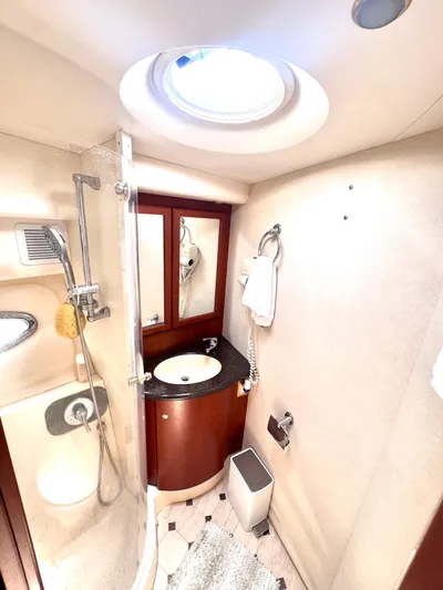 A Whole New World Yacht Photos Pics Luxurious bathroom in 2006 Silverton 50 Convertible yacht with shower and vanity.