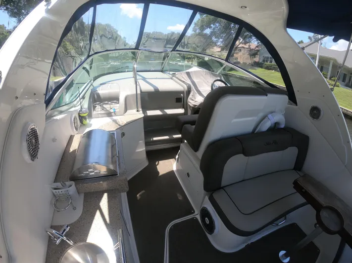 Stella Nautica Yacht Photos Pics Interior of 2015 Sea Ray 330 Sundancer boat with seating and helm.