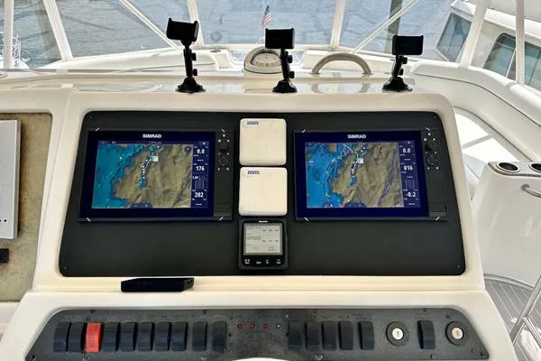 A Whole New World Yacht Photos Pics 2006 Silverton 50 Convertible yacht helm with dual Simrad navigation displays.