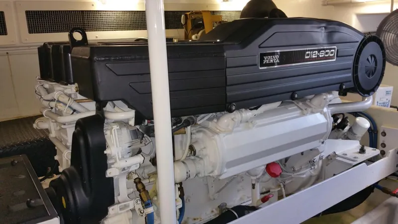 A Whole New World Yacht Photos Pics 2006 Silverton 50 Convertible engine room with Volvo Penta D12-800 engine.