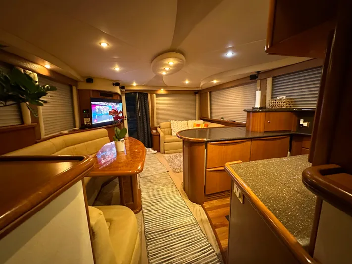 A Whole New World Yacht Photos Pics Luxurious interior of a 2006 Silverton 50 Convertible yacht with modern amenities.