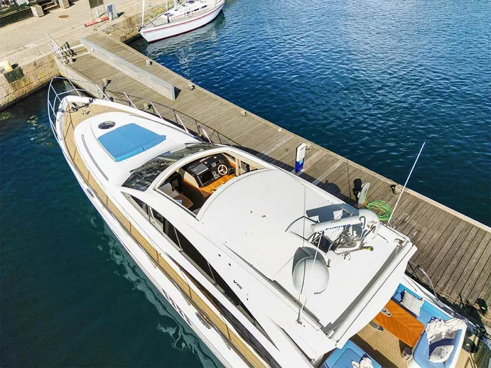  Yacht Photos Pics 2008 Princess V65 yacht docked at a marina, viewed from above.