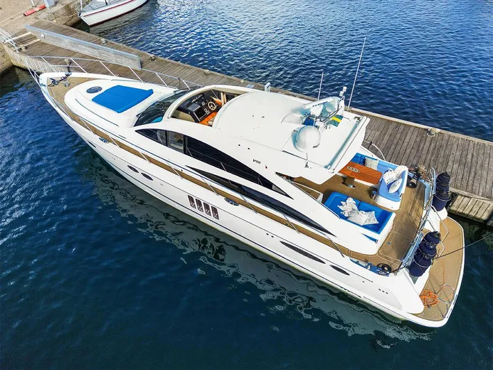  Yacht Photos Pics 2008 Princess V65 yacht docked at a marina, viewed from above.