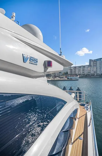  Yacht Photos Pics 2008 Princess V65 yacht docked in sunny marina, showcasing sleek design and modern architecture.