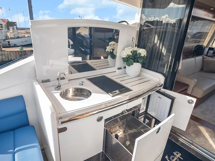  Yacht Photos Pics Luxurious 2008 Princess V65 yacht interior with kitchenette, sink, and elegant decor.