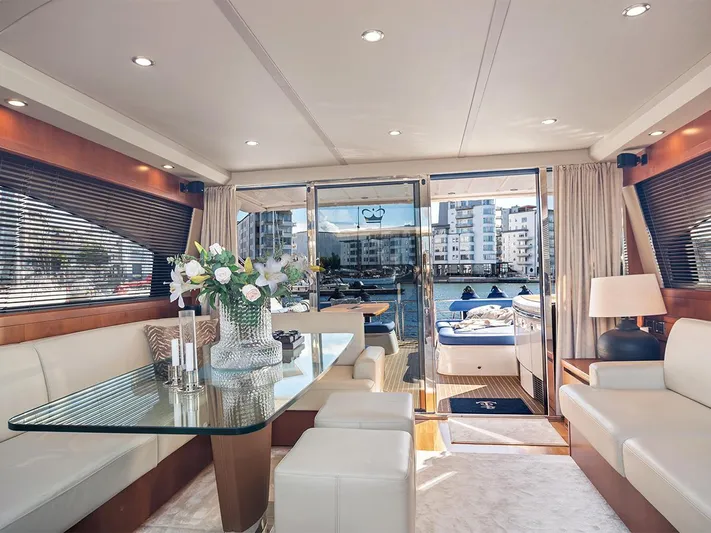  Yacht Photos Pics Luxurious interior of 2008 Princess V65 yacht with elegant seating and floral centerpiece.