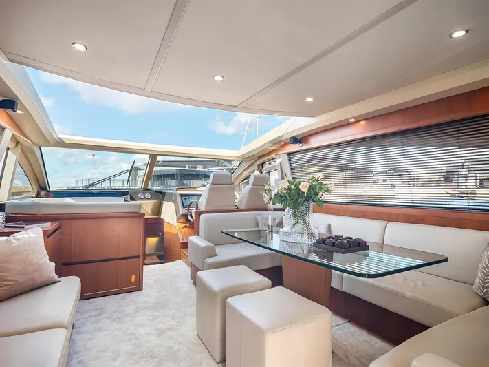  Yacht Photos Pics Luxurious interior of 2008 Princess V65 yacht with elegant seating and glass table.