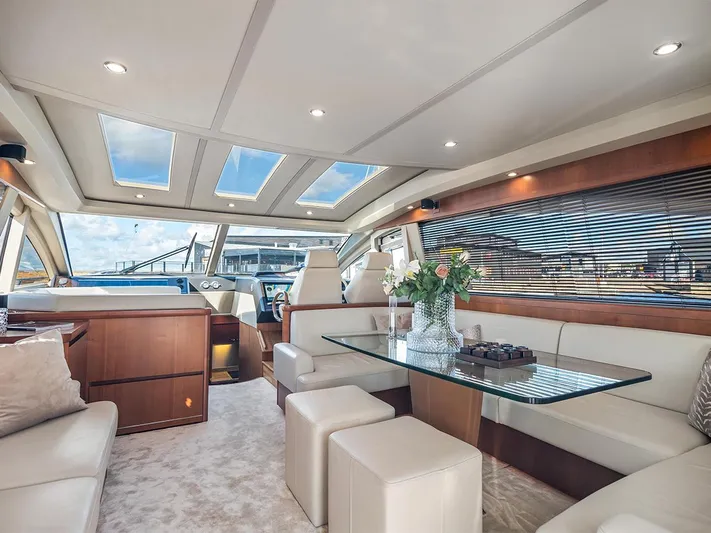  Yacht Photos Pics Luxurious interior of 2008 Princess V65 yacht with elegant seating and skylights.
