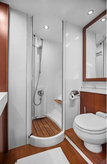  Yacht Photos Pics Luxurious bathroom in 2008 Princess V65 yacht with modern shower and wooden accents.
