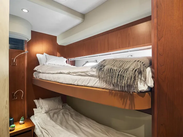  Yacht Photos Pics Cozy bunk beds in 2008 Princess V65 yacht cabin with wooden interior.