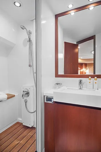  Yacht Photos Pics Luxurious bathroom in 2008 Princess V65 yacht with modern fixtures and wooden accents.