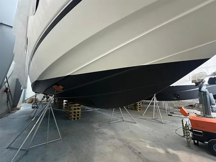  Yacht Photos Pics 2008 Princess V65 yacht hull in dry dock, supported by stands.