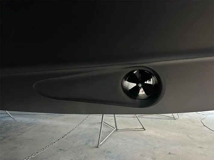  Yacht Photos Pics Close-up of a 2008 Princess V65 yacht's hull with a visible thruster.