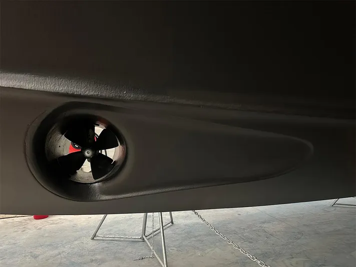  Yacht Photos Pics Close-up of a 2008 Princess V65 boat thruster in a dry dock setting.