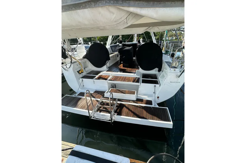 Lele Kalua Yacht Photos Pics 2014 Beneteau Oceanis 41 yacht with wooden deck and swim ladder.