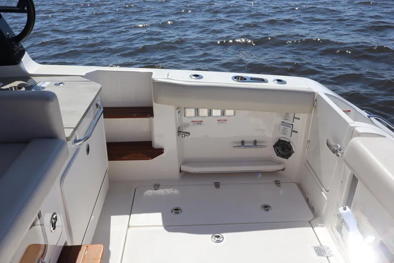  Yacht Photos Pics 2023 Boston Whaler 350 Realm boat interior with seating and ocean view.