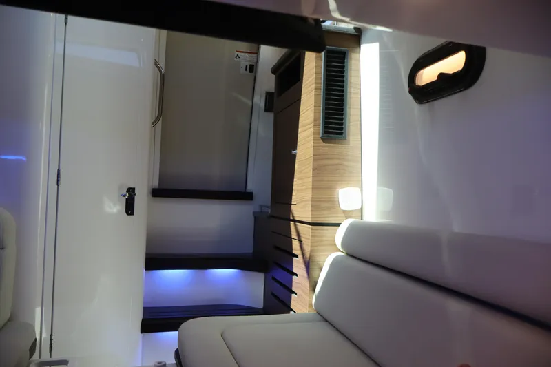  Yacht Photos Pics Interior of 2023 Boston Whaler 350 Realm, featuring modern seating and ambient lighting.