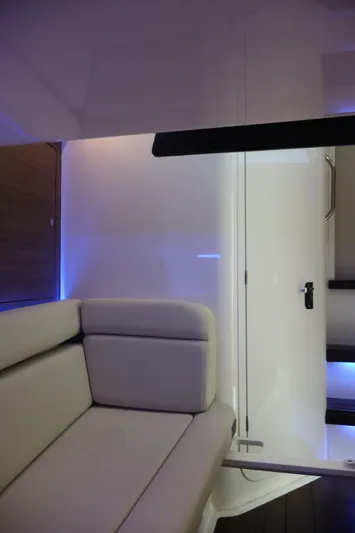  Yacht Photos Pics Interior of 2023 Boston Whaler 350 Realm, featuring modern seating and ambient lighting.