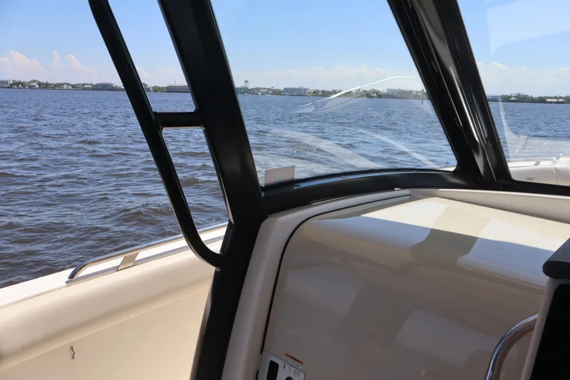  Yacht Photos Pics 2023 Boston Whaler 350 Realm interior view with ocean backdrop.
