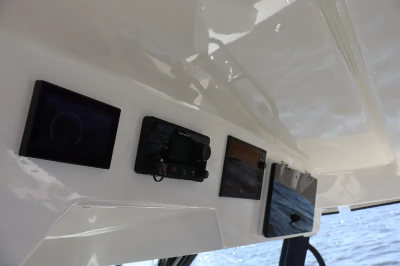  Yacht Photos Pics Control panel of 2023 Boston Whaler 350 Realm boat with navigation screens.