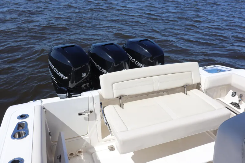  Yacht Photos Pics 2023 Boston Whaler 350 Realm boat with triple Mercury engines on open water.