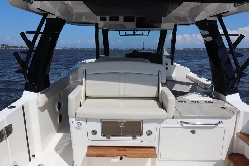  Yacht Photos Pics 2023 Boston Whaler 350 Realm boat interior with seating and ocean view.