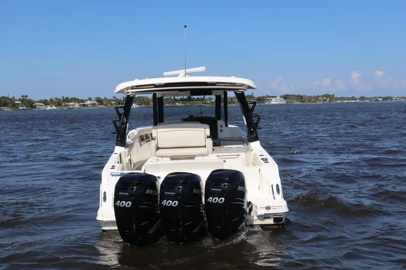  Yacht Photos Pics 2023 Boston Whaler 350 Realm with triple 400 horsepower engines on open water.