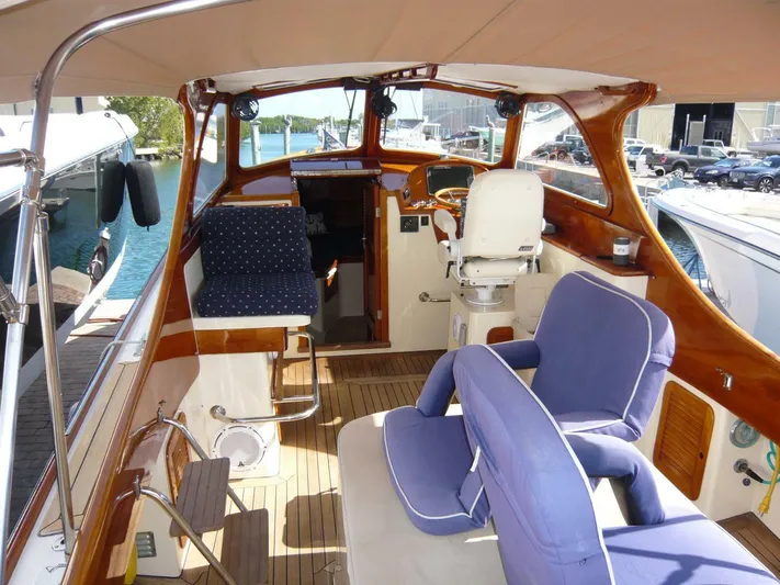Courage Yacht Photos Pics Interior of a 1998 Hinckley 36 Classic yacht with elegant seating and wooden finishes.