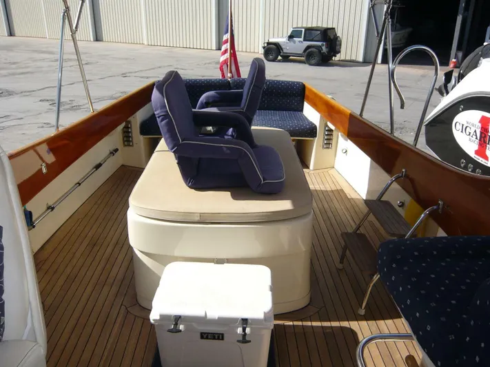 Courage Yacht Photos Pics Hinckley 36 Classic 1998 boat interior with cushioned seating and wooden deck.