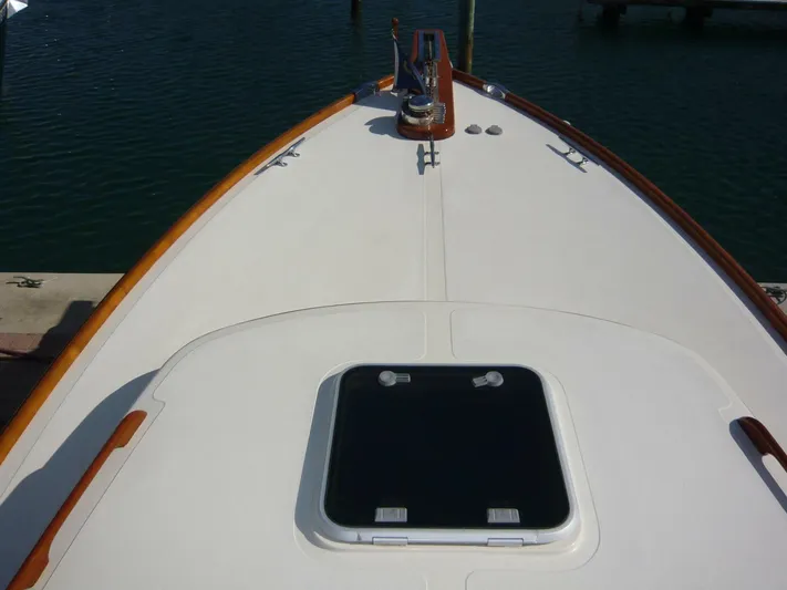 Courage Yacht Photos Pics Bow view of 1998 Hinckley 36 Classic yacht with wooden trim and hatch.