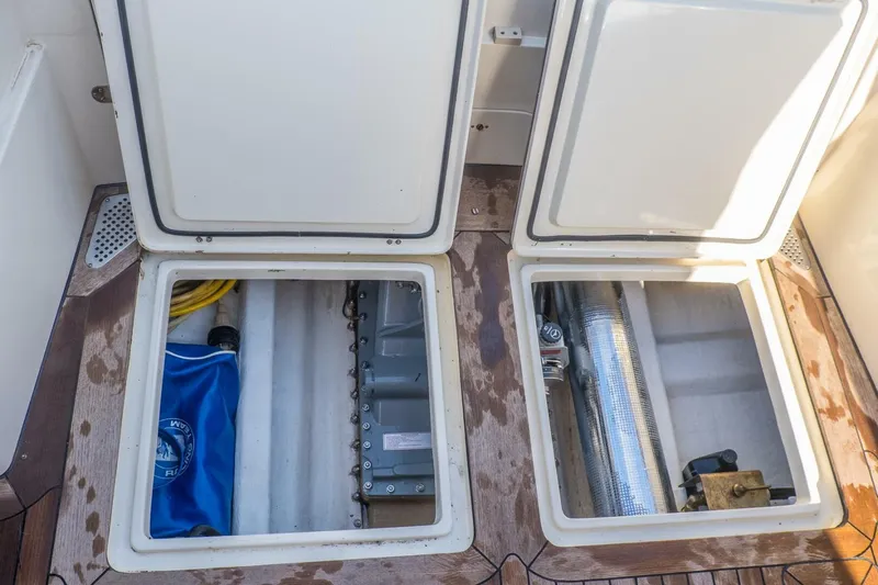 Courage Yacht Photos Pics Open storage compartments on a 1998 Hinckley 36 Classic boat deck.