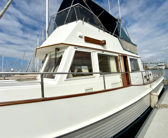 Tenacious Yacht Photos Pics 2003 Grand Banks Classic yacht docked, side view.