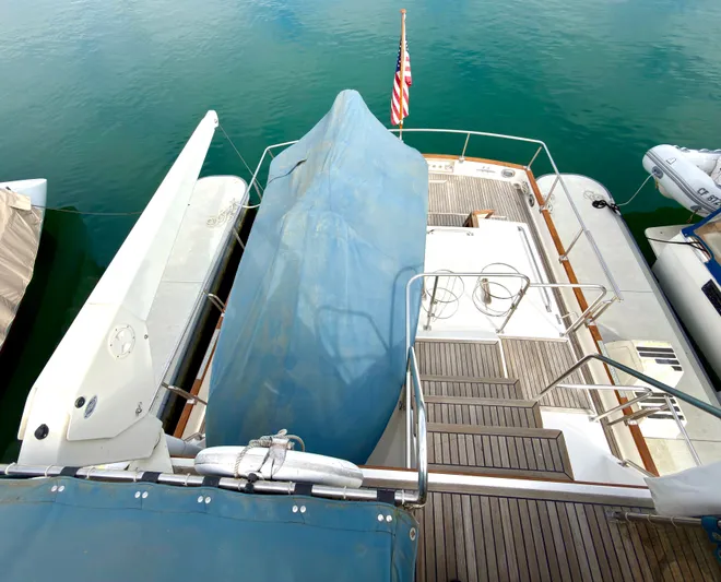 Tenacious Yacht Photos Pics Grand Banks Classic 2003 yacht with cover in harbor.