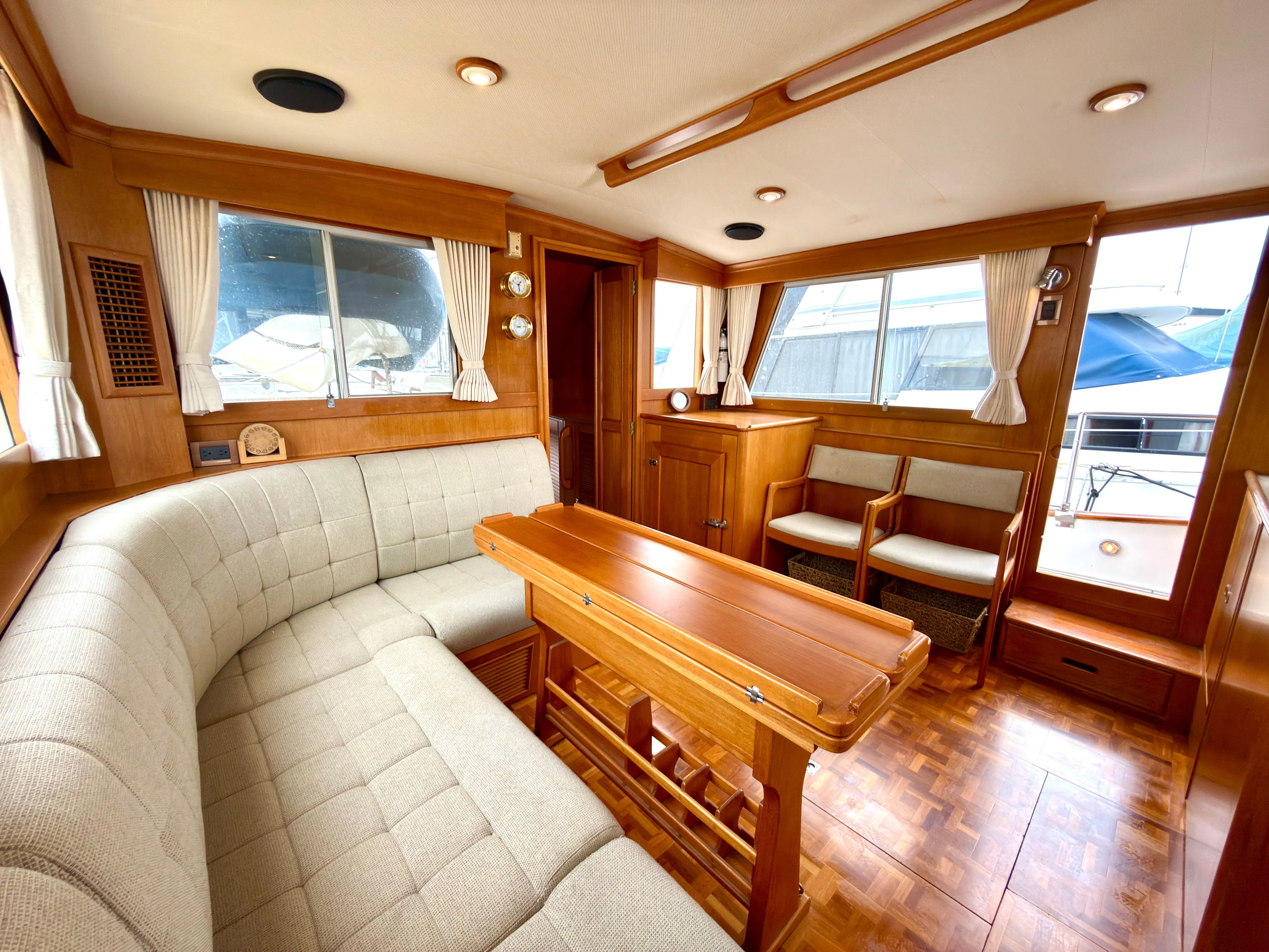Tenacious Yacht Photos Pics Interior of a 2003 Grand Banks Classic yacht with wooden furnishings.
