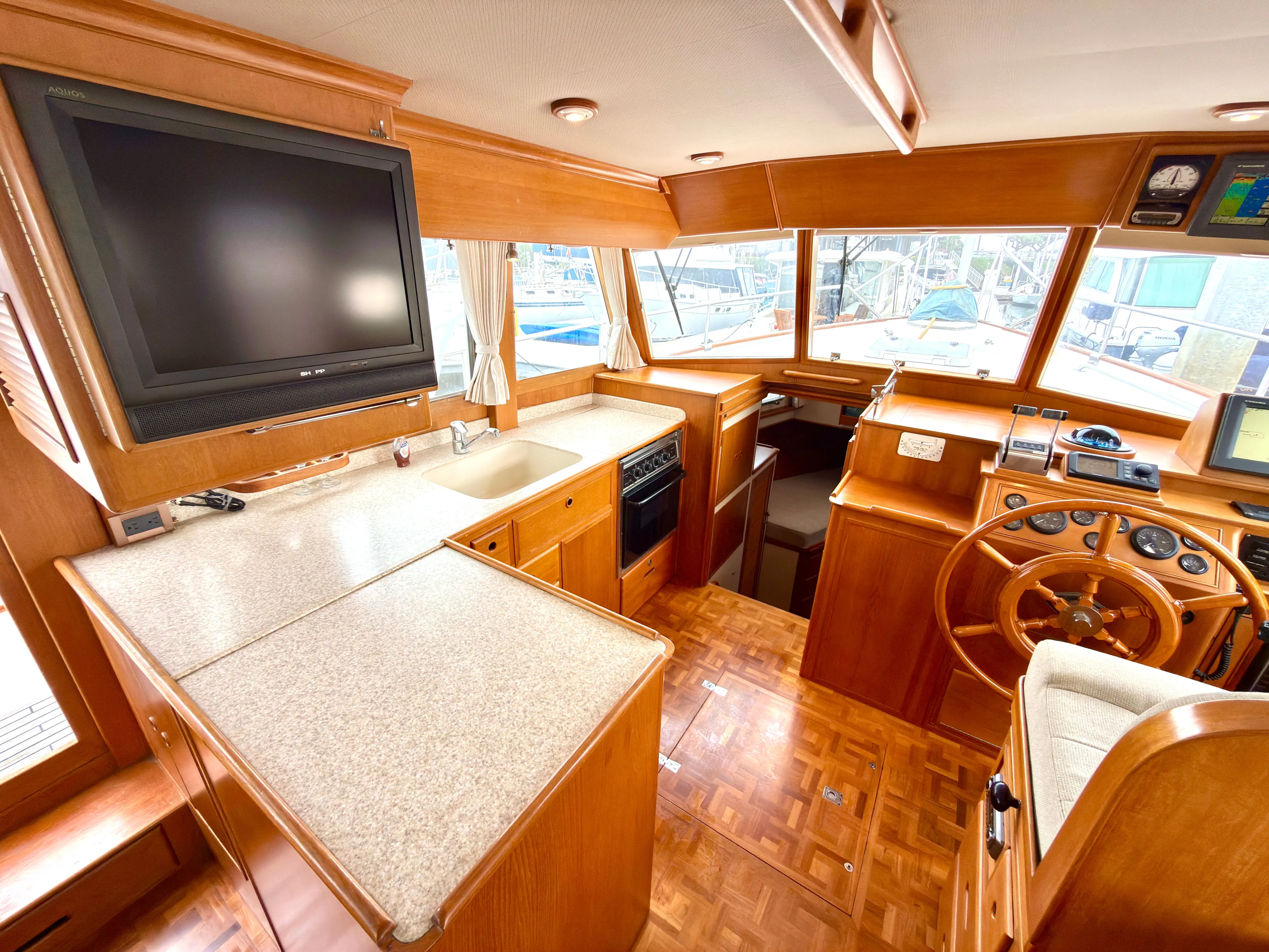 Tenacious Yacht Photos Pics Interior of a 2003 Grand Banks Classic yacht with wooden finish.