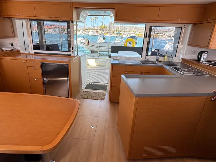  Yacht Photos Pics Interior of 2017 Lagoon 450 F catamaran with modern kitchen and ocean view.