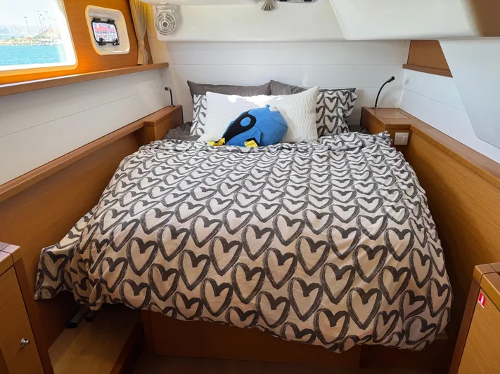  Yacht Photos Pics Cozy bedroom in 2017 Lagoon 450 F yacht with heart-patterned bedding and plush toy.