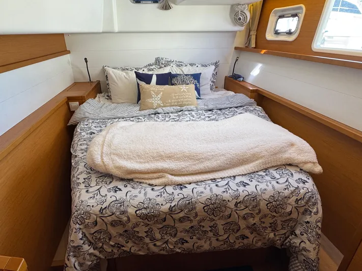  Yacht Photos Pics Cozy bedroom in 2017 Lagoon 450 F yacht with floral bedding and natural light.