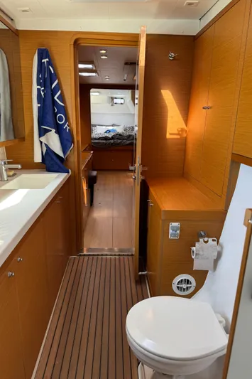  Yacht Photos Pics Interior of 2017 Lagoon 450 F yacht, featuring bathroom and cabin with wooden finishes.