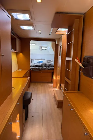  Yacht Photos Pics Interior of 2017 Lagoon 450 F yacht with wood finish and cozy sleeping area.