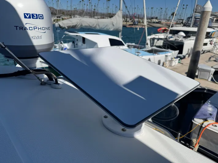  Yacht Photos Pics Satellite dish on 2017 Lagoon 450 F yacht, docked at marina with boats in background.