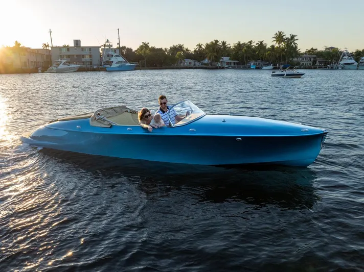  Yacht Photos Pics 2022 Seven Seas Yachts Hermes Speedster cruising on a serene waterway at sunset.
