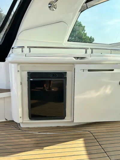  Yacht Photos Pics 2007 Sea Ray 52 Sundancer yacht interior with sleek cabinetry and built-in mini fridge.