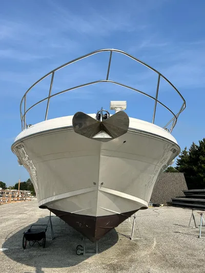  Yacht Photos Pics 2007 Sea Ray 52 Sundancer yacht on dry dock under clear blue sky.